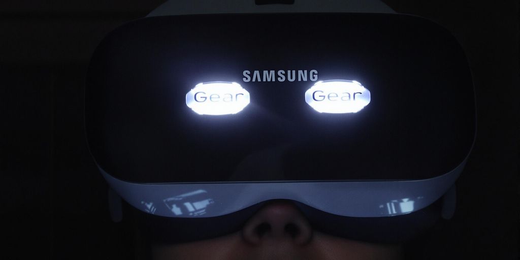 Man wearing VR headset, watching 3D movie.